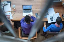 Male student studying in UBC library on laptop
